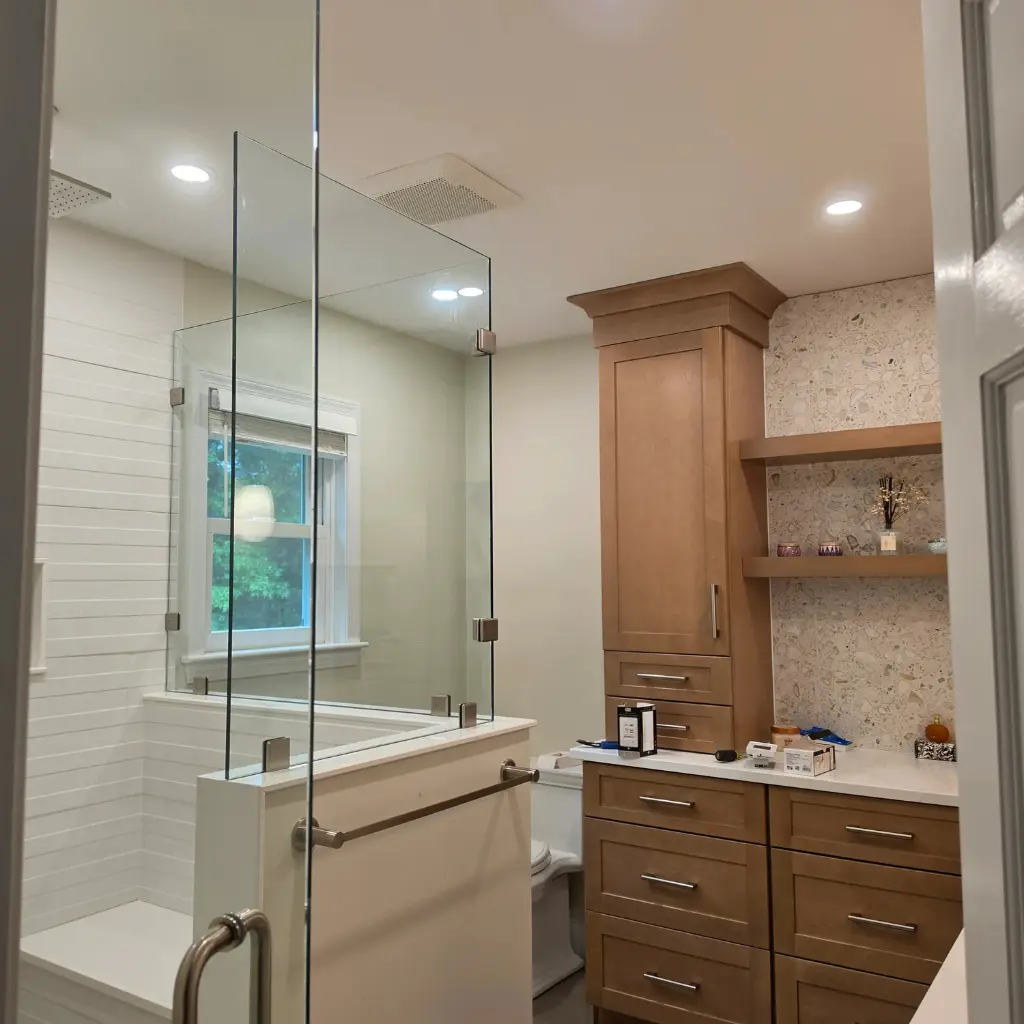 Recessed ceiling lights installed in a remodeled residential bathroom