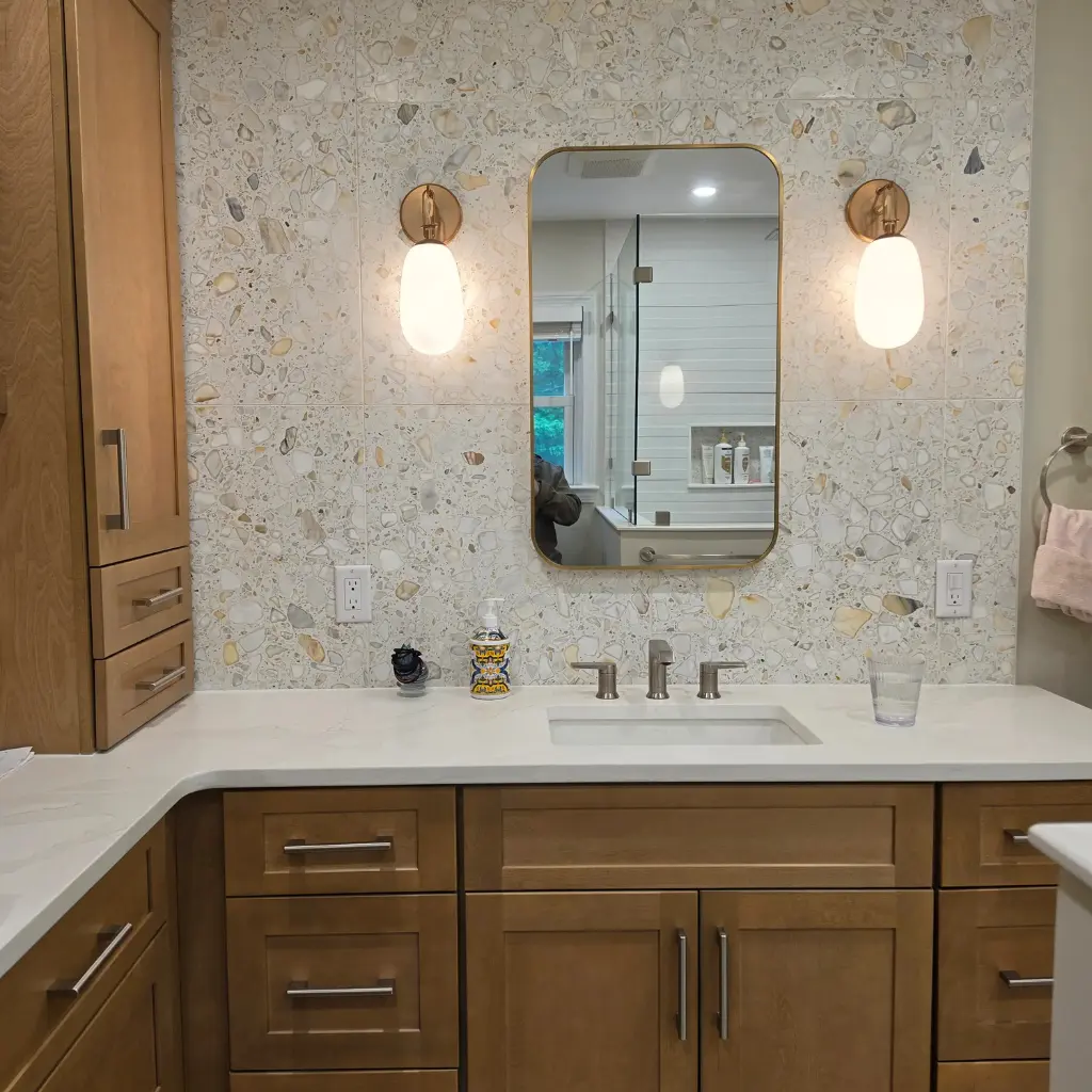 Bathroom vanity lighting installation with wall sconces in Lowell, MA