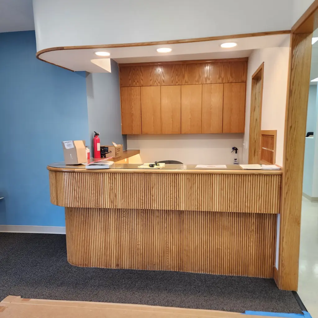 Recessed lighting installed above a commercial reception desk