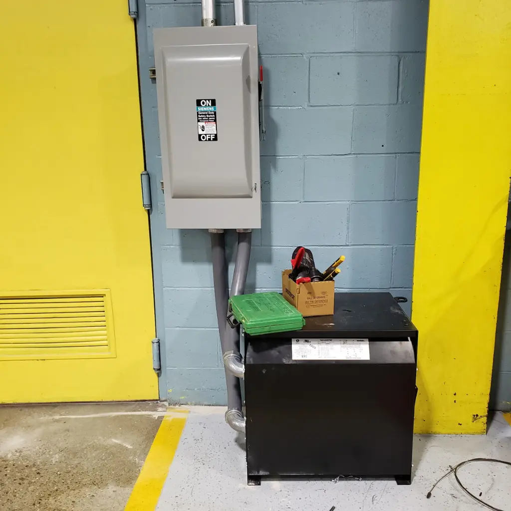Siemens commercial safety disconnect switch installed above an electrical transformer