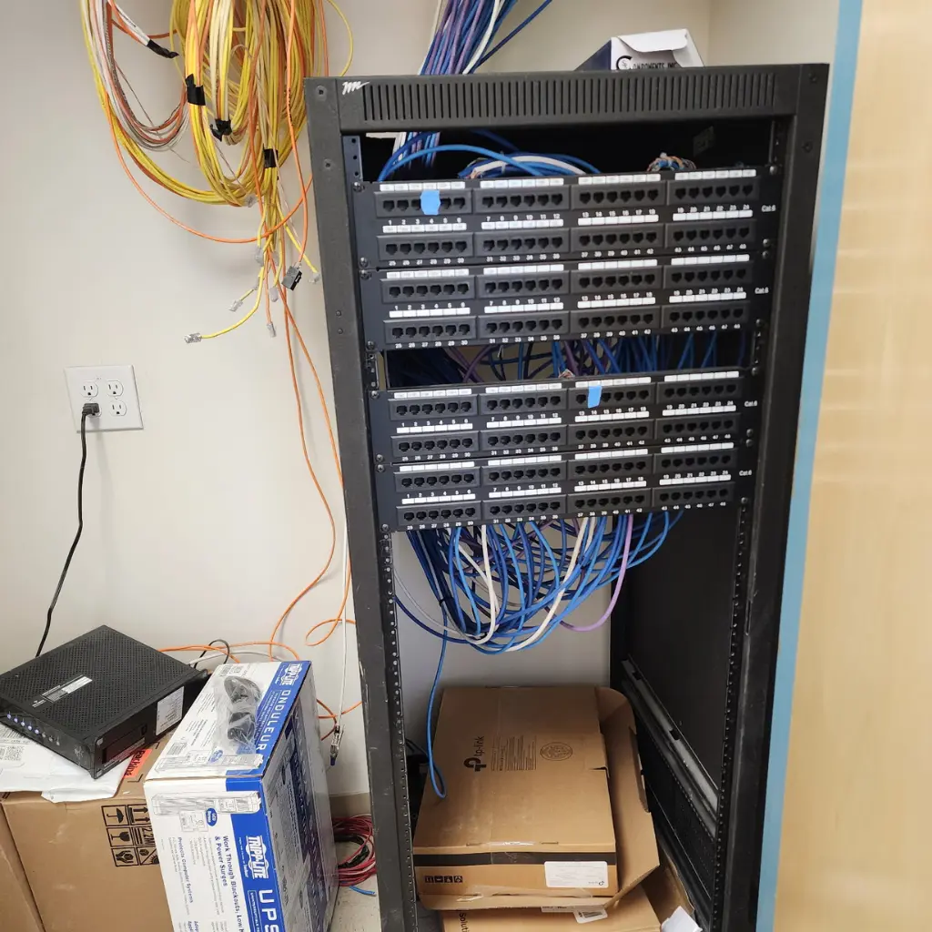 Commercial network rack with Ethernet patch panels and structured data cabling